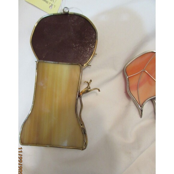 Stained glass leaves and lion handmade ornaments hang in window - Picture 4 of 7